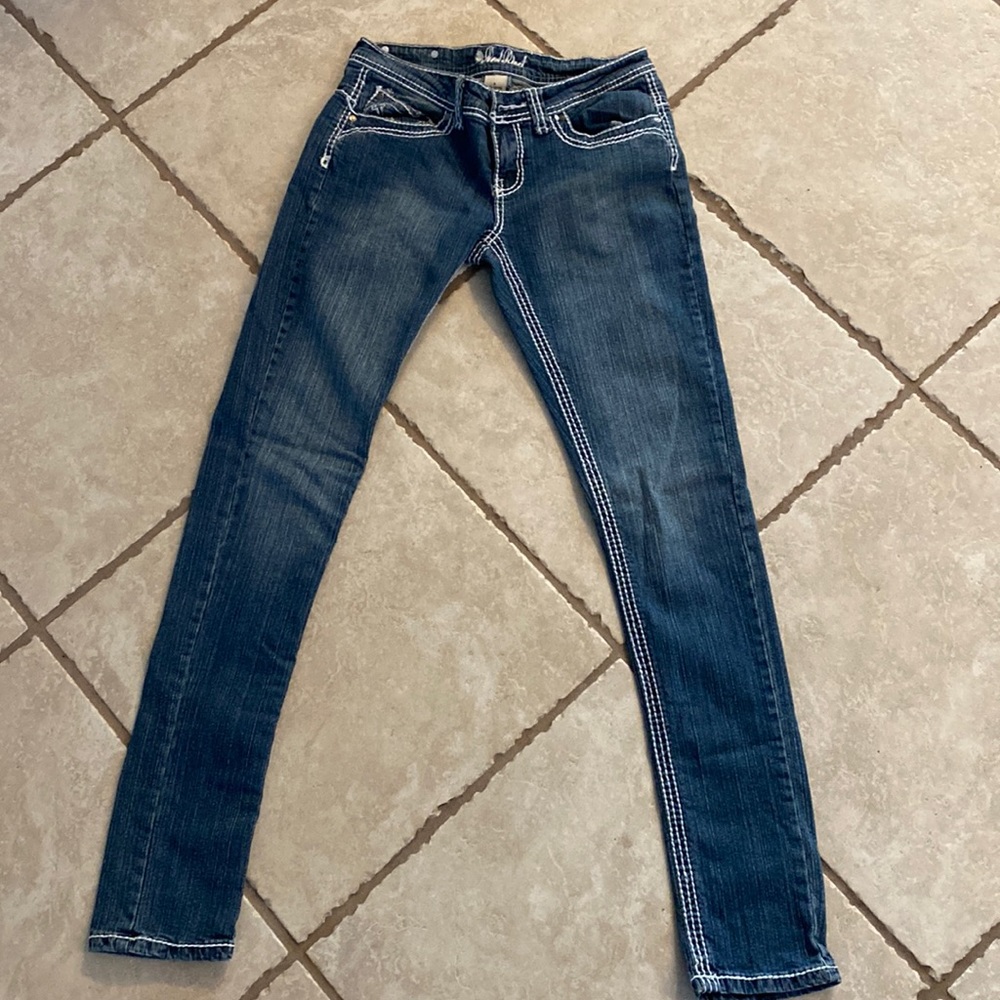 Red Rivet low rise skinny jeans.